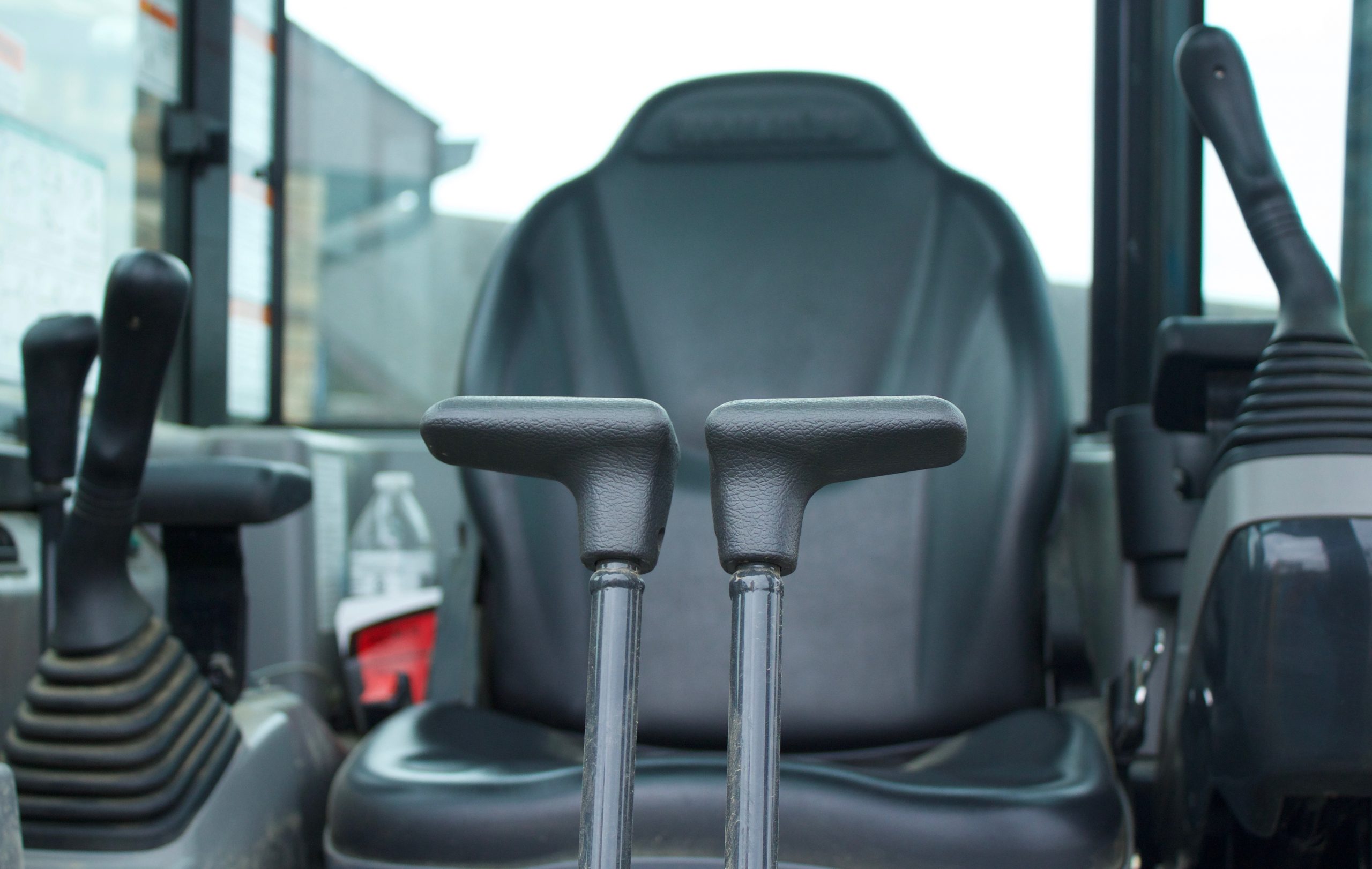 A close-up of a driver's seat in heavy equipment, women in the construction industry can operate these machines.